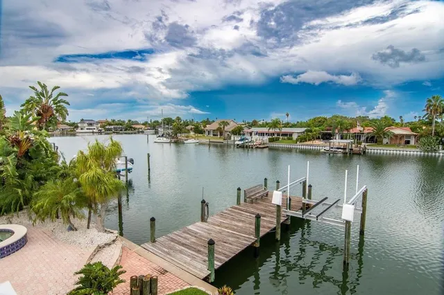a bathroom with a granite countertop toilet sink and mirror