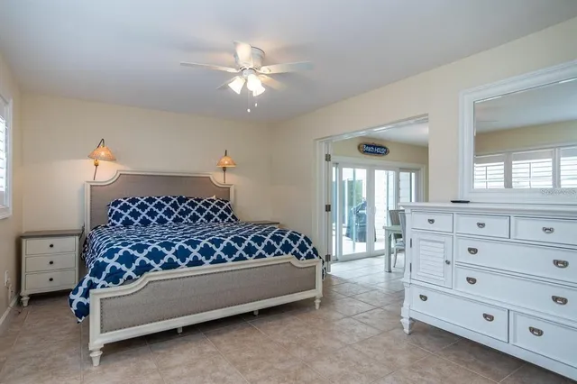 a very nice looking living room with a large window and a chandelier