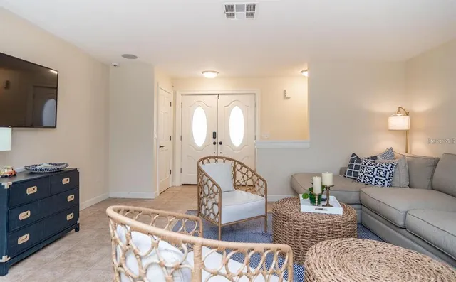 a bathroom with a granite countertop sink and a shower