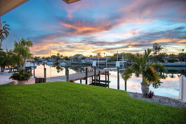 a kitchen with stainless steel appliances granite countertop a stove top oven a sink a counter space and cabinets