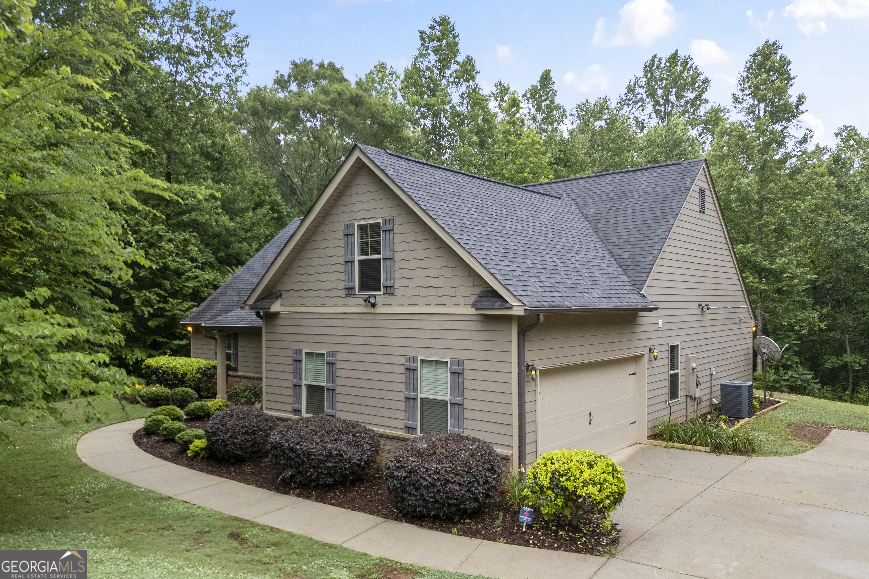 717 Oconee Lane Commerce, GA 30529 - Photo 6 of 57 a house that has a lot of plants in front of it