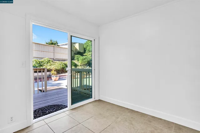 a view of a patio with couches table and chairs and potted plants