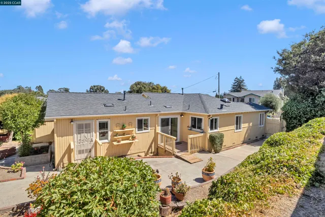 a view of backyard with patio