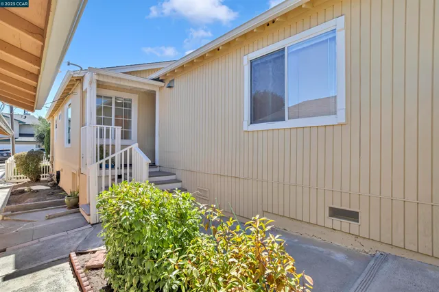 an empty room with closet and natural light