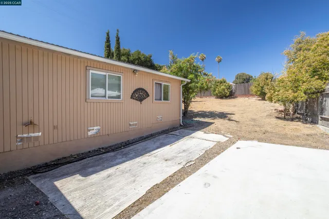 a backyard of a house with lots of green space