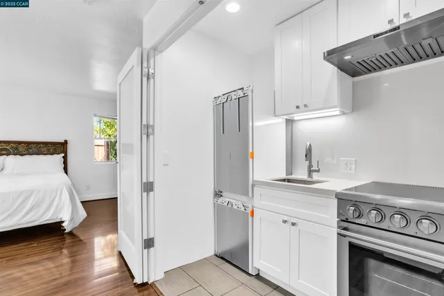 a kitchen with a stove and a refrigerator