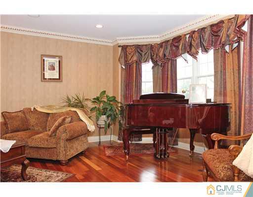 6 Ramsey Road Edison, NJ 08820 - Photo 2 of 25 a living room with furniture and a large window