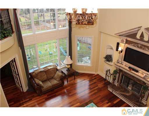 6 Ramsey Road Edison, NJ 08820 - Photo 12 of 25 a living room with furniture and a flat screen tv