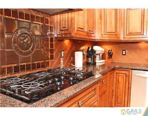 6 Ramsey Road Edison, NJ 08820 - Photo 14 of 25 a kitchen with a stove and a sink