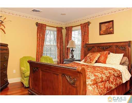 6 Ramsey Road Edison, NJ 08820 - Photo 20 of 25 a bedroom with a bed and a window