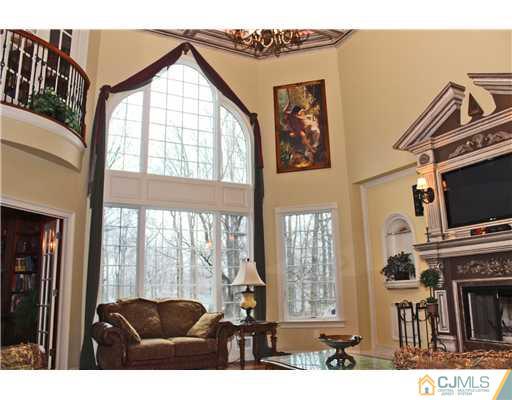 6 Ramsey Road Edison, NJ 08820 - Photo 3 of 25 a living room with furniture a flat screen tv and a large window