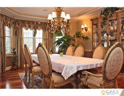 6 Ramsey Road Edison, NJ 08820 - Photo 5 of 25 a view of a dining room with furniture and a chandelier