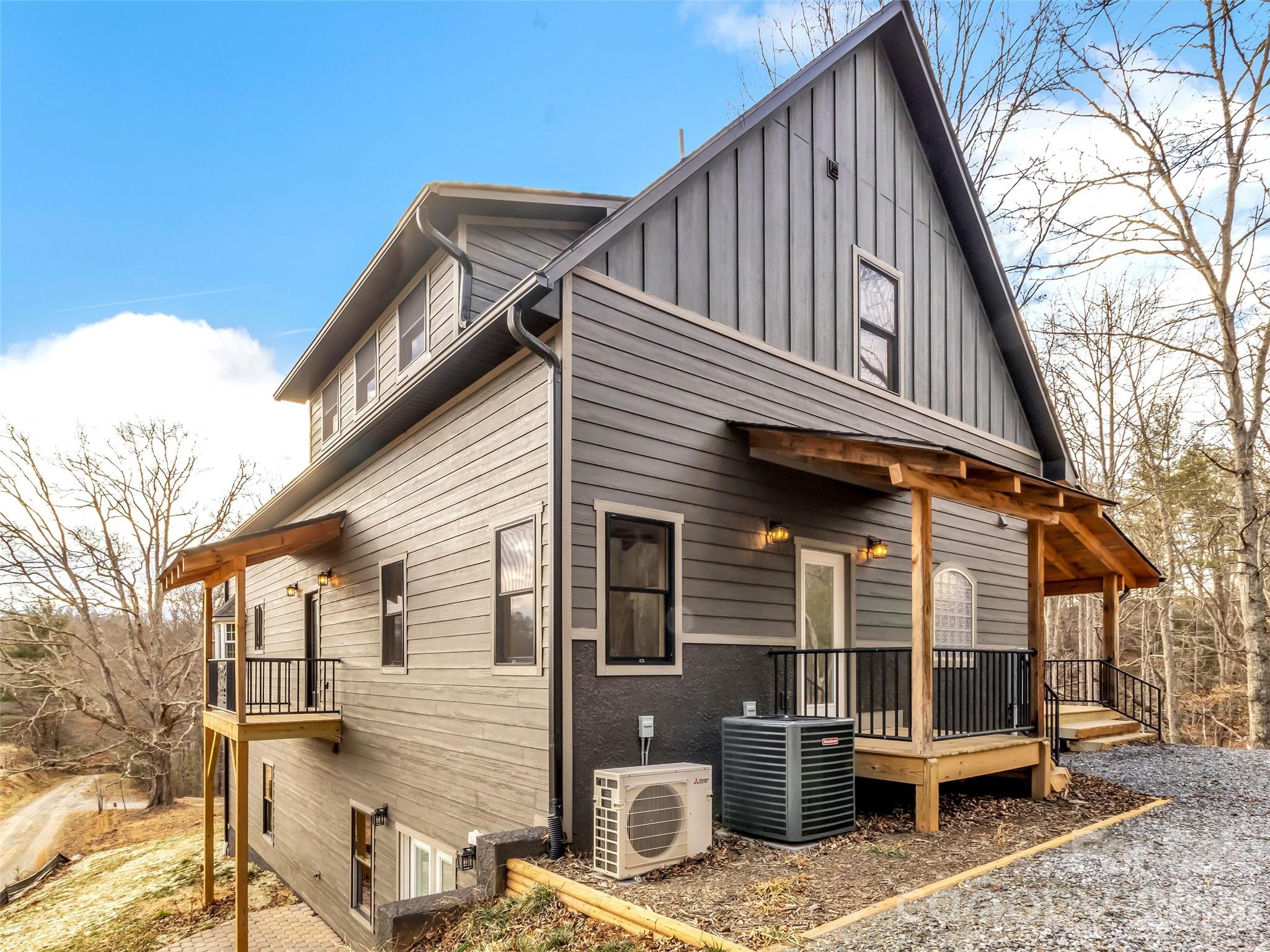 171 Cowtail Cove Clyde, NC 28721 - Photo 19 of 48 a backyard of a house with barbeque oven and outdoor seating