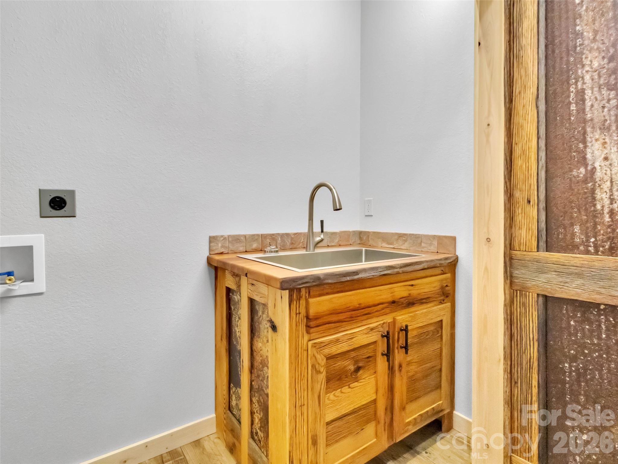 171 Cowtail Cove Clyde, NC 28721 - Photo 21 of 48 a bathroom with a sink and a mirror