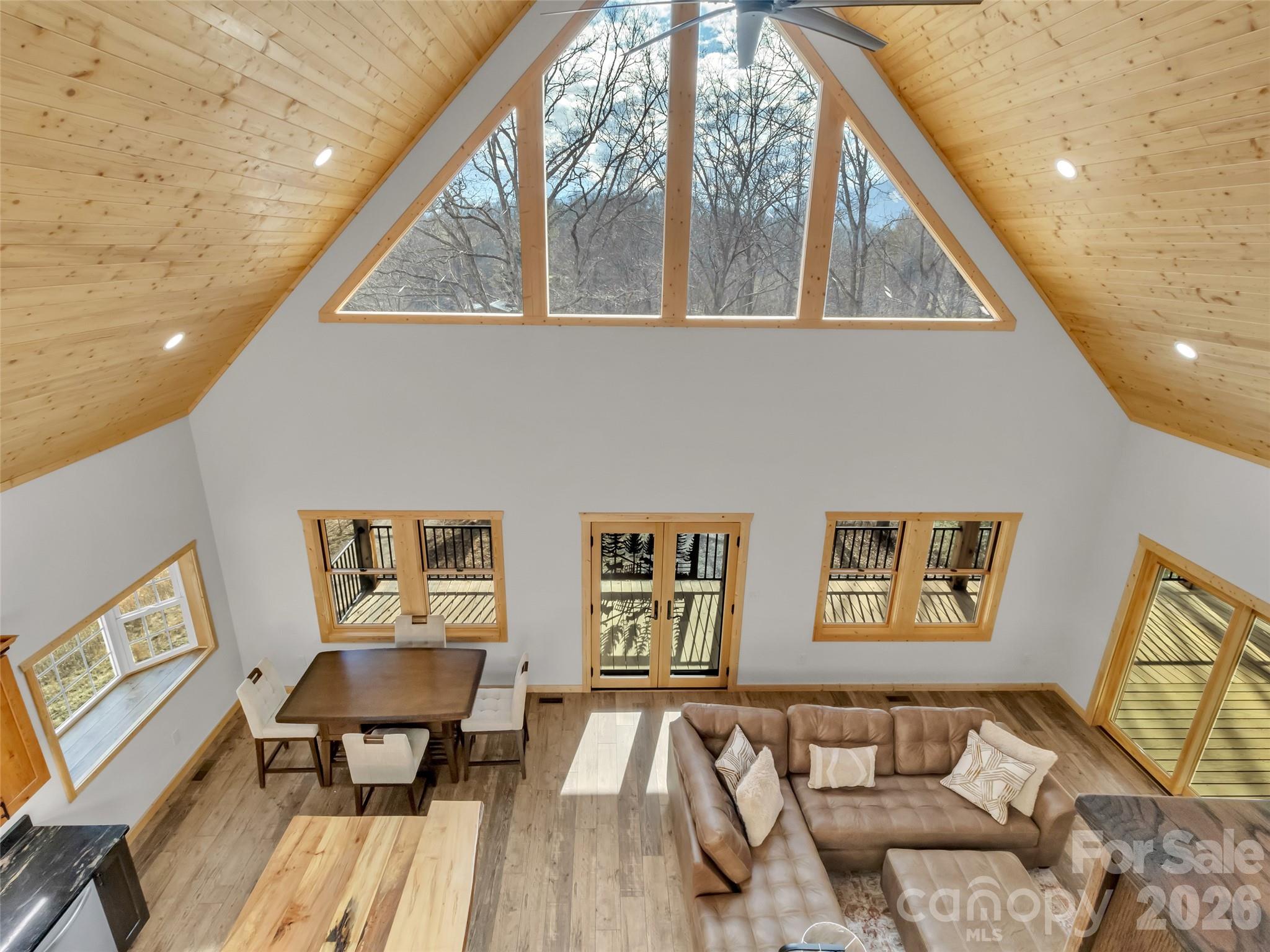 171 Cowtail Cove Clyde, NC 28721 - Photo 26 of 48 a living room with couches and painting on the wall