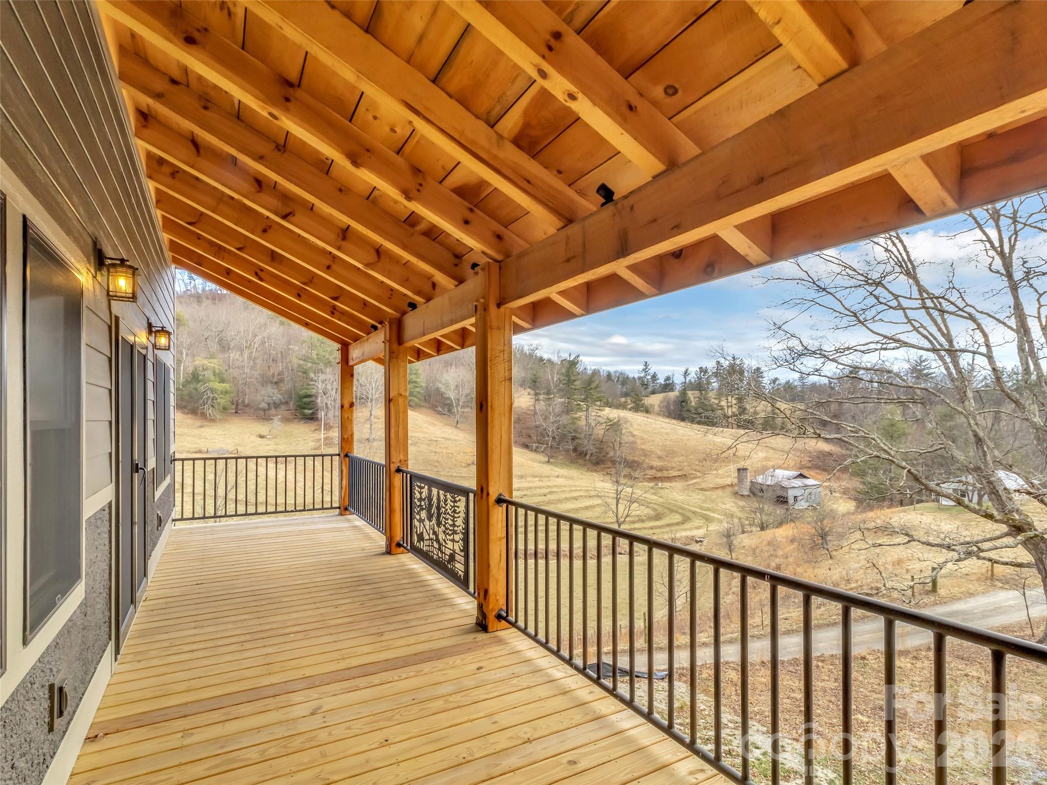171 Cowtail Cove Clyde, NC 28721 - Photo 43 of 48 a view of a porch with wooden floor