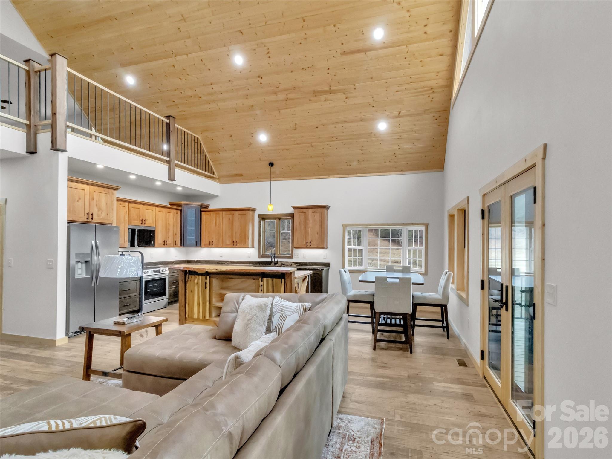 171 Cowtail Cove Clyde, NC 28721 - Photo 5 of 48 a living room with fireplace furniture and a table