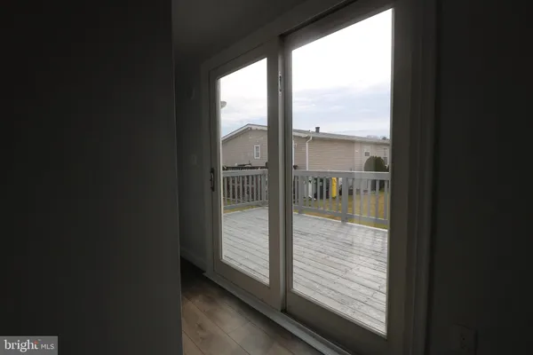 a view of a glass door and a yard from a window