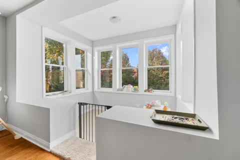 a room with a window and pool table