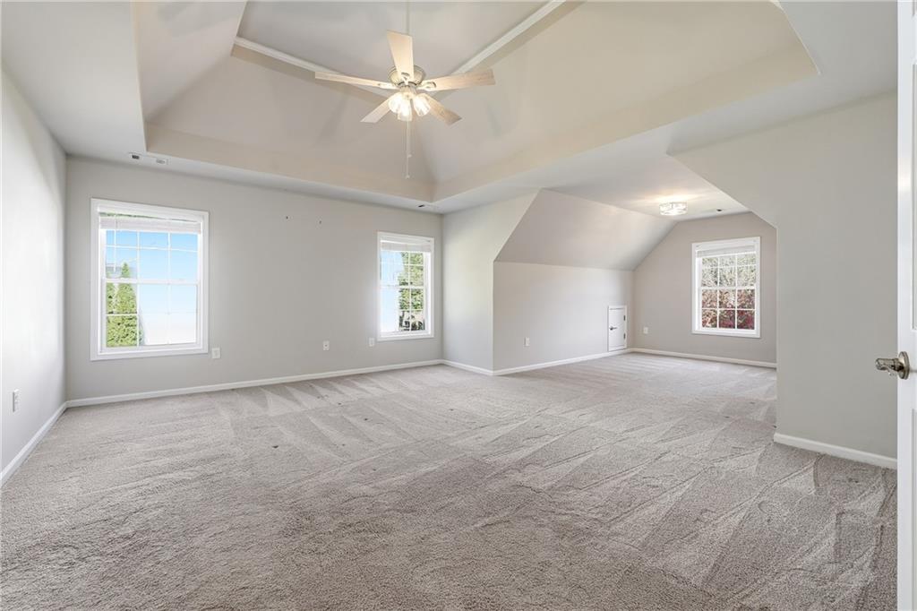 304 Meadowcrest Circle Canton, GA 30115 - Photo 19 of 50 an empty room with windows and fan