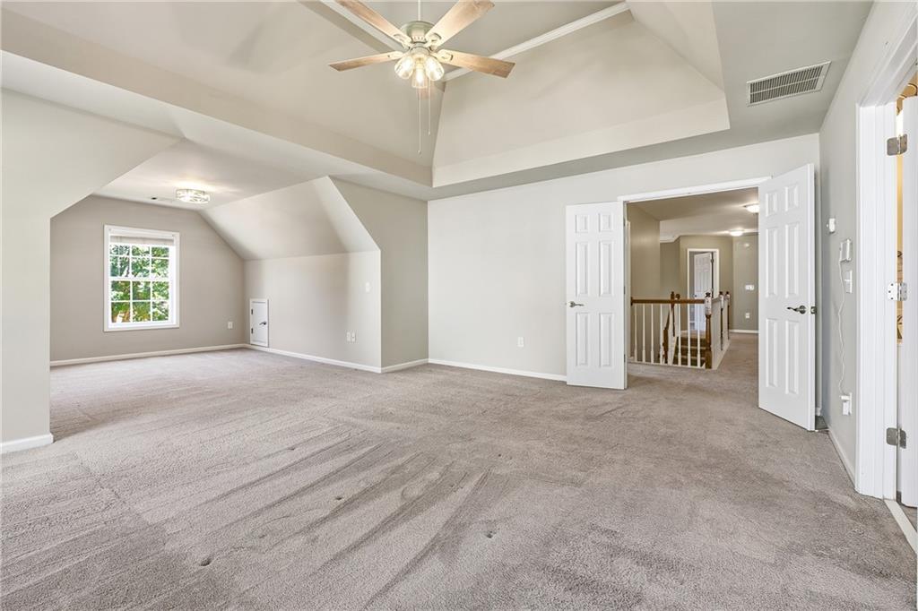 304 Meadowcrest Circle Canton, GA 30115 - Photo 20 of 50 an empty room with windows and fan