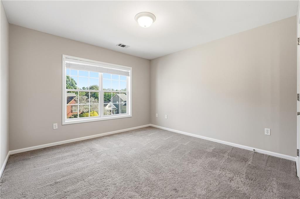304 Meadowcrest Circle Canton, GA 30115 - Photo 23 of 50 an empty room with windows