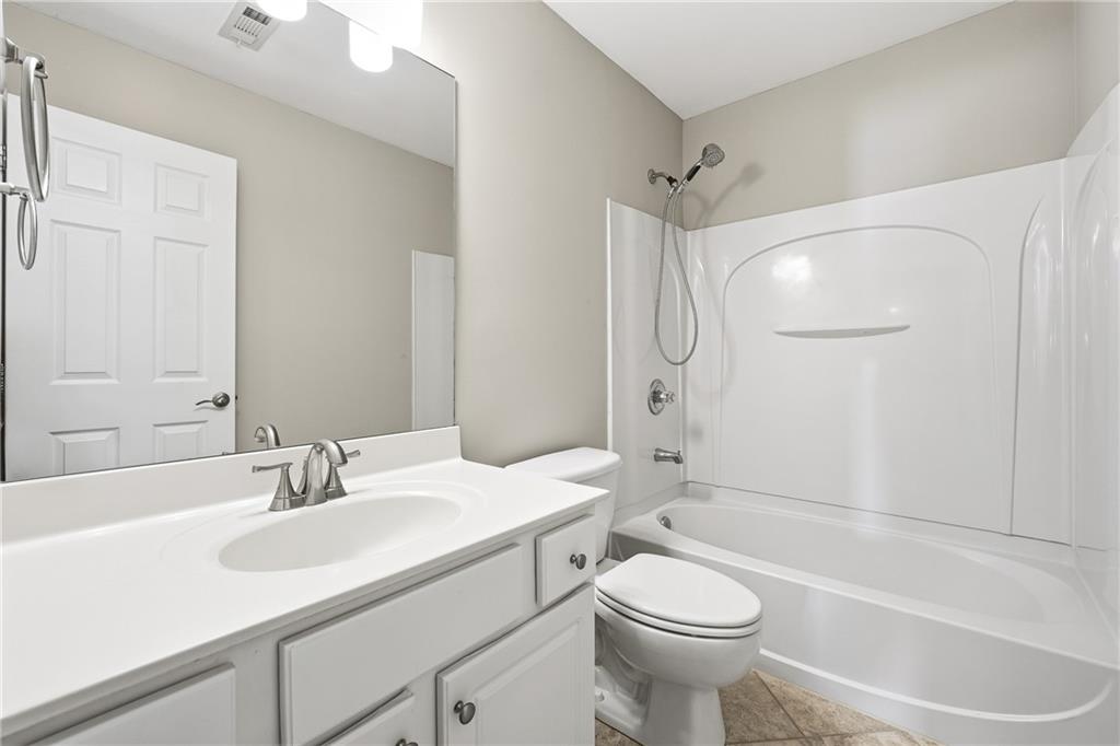 304 Meadowcrest Circle Canton, GA 30115 - Photo 24 of 50 a bathroom with a sink toilet and shower