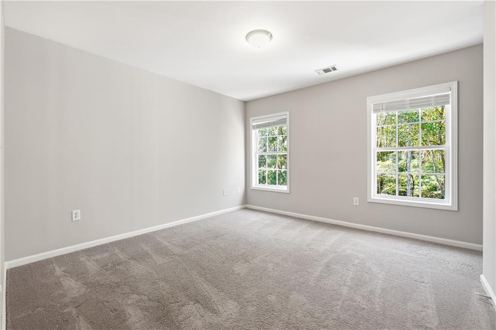 304 Meadowcrest Circle Canton, GA 30115 - Photo 25 of 50 an empty room with windows and closet