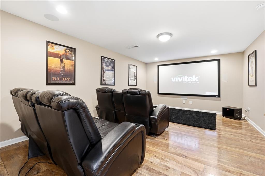 304 Meadowcrest Circle Canton, GA 30115 - Photo 27 of 50 a living room with furniture and a flat screen tv