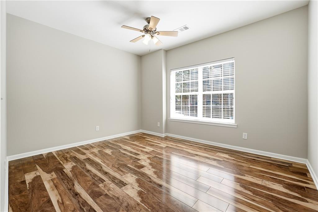 304 Meadowcrest Circle Canton, GA 30115 - Photo 30 of 50 a view of a bedroom with a natural light