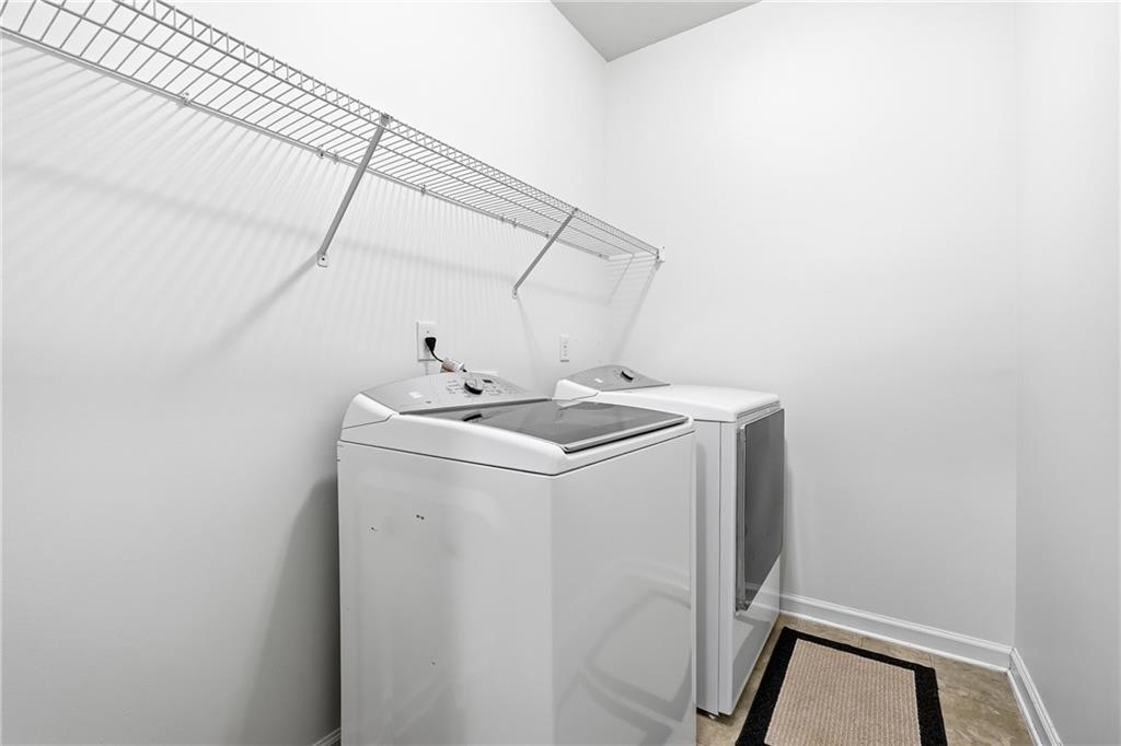 304 Meadowcrest Circle Canton, GA 30115 - Photo 33 of 50 a utility room with dryer and washer