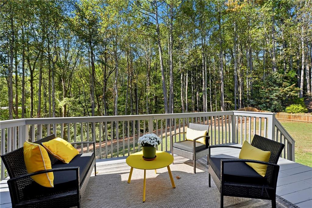 304 Meadowcrest Circle Canton, GA 30115 - Photo 35 of 50 a balcony with wooden floor and outdoor seating