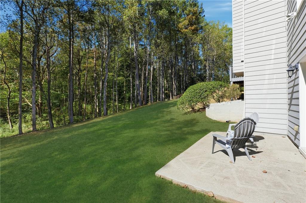 304 Meadowcrest Circle Canton, GA 30115 - Photo 36 of 50 a view of a chair and table in backyard of the house