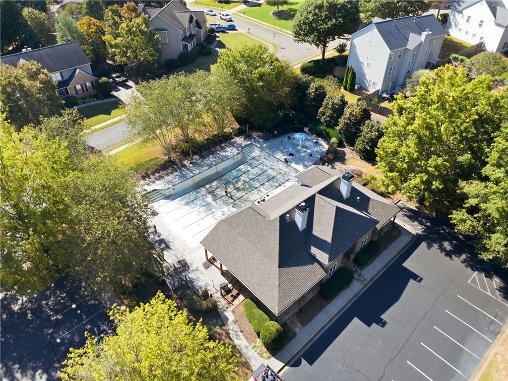 304 Meadowcrest Circle Canton, GA 30115 - Photo 47 of 50 a view of a house with a yard and a wooden bench