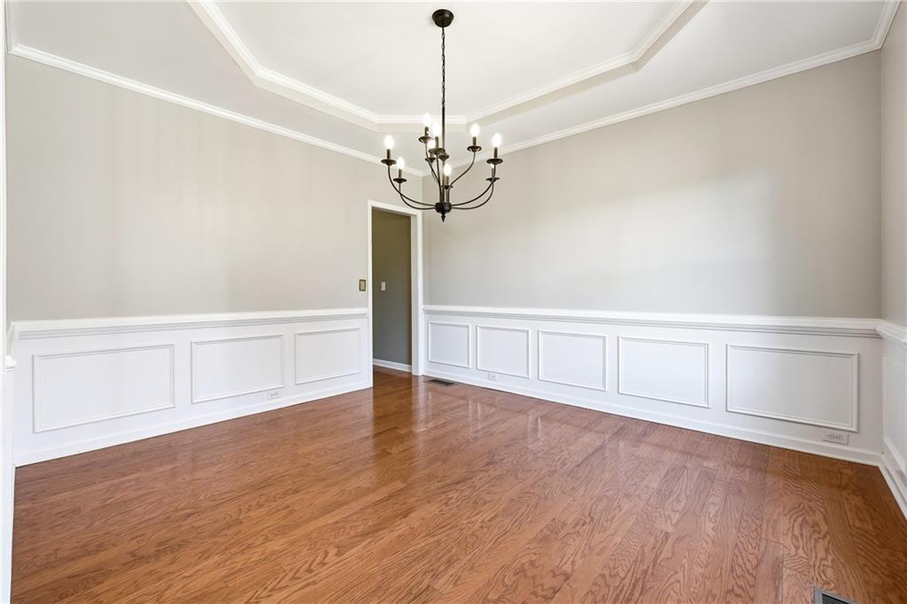 304 Meadowcrest Circle Canton, GA 30115 - Photo 8 of 50 a view of an empty room with chandelier