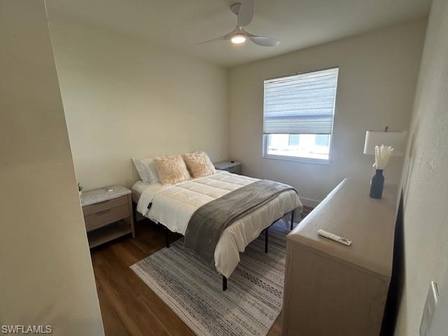 430 Crossfield Circle Naples, FL 34104 - Photo 20 of 24 a bedroom with a bed and wooden floor