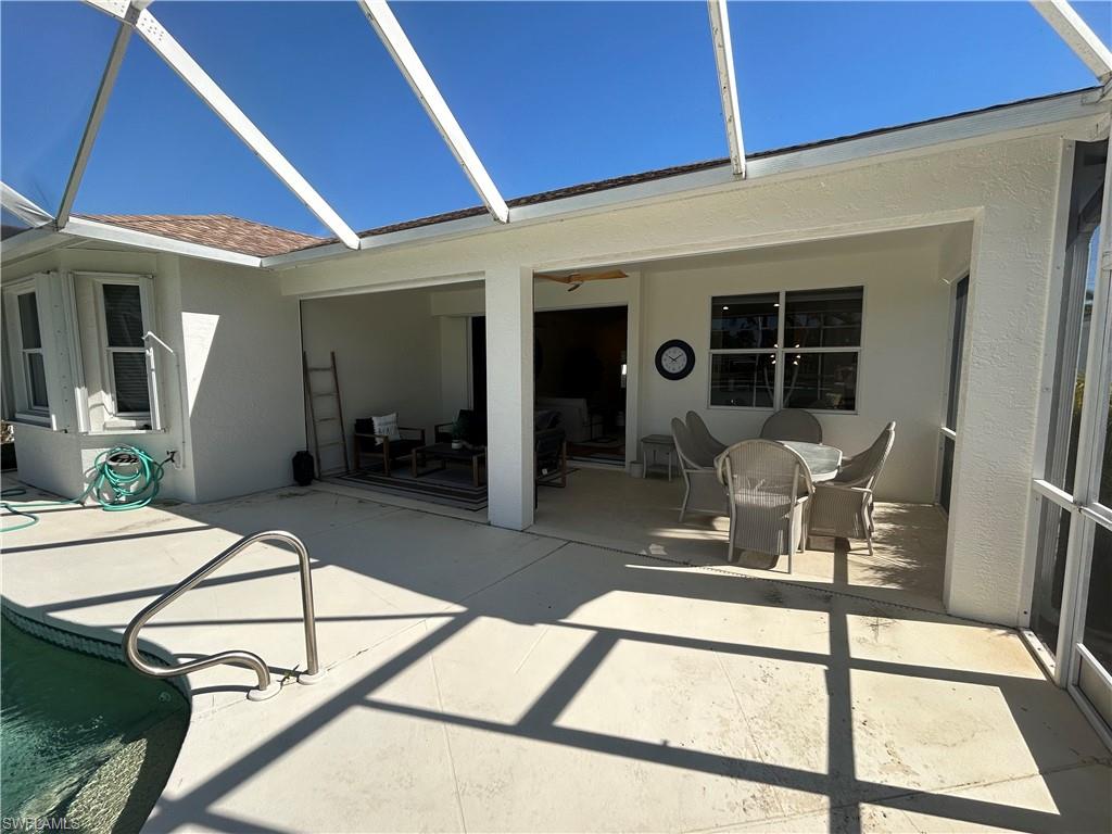 430 Crossfield Circle Naples, FL 34104 - Photo 21 of 24 a dining room with furniture and a window