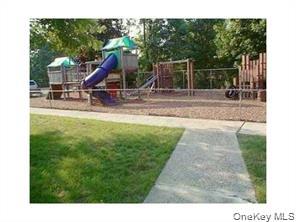 122 Sneden Place West, Unit 122 Spring Valley, NY 10977 - Photo 18 of 20 Community jungle gym featuring a yard