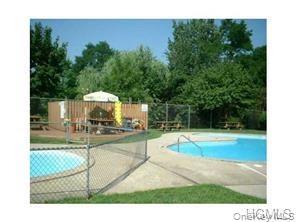 122 Sneden Place West, Unit 122 Spring Valley, NY 10977 - Photo 20 of 20 View of pool with a patio area