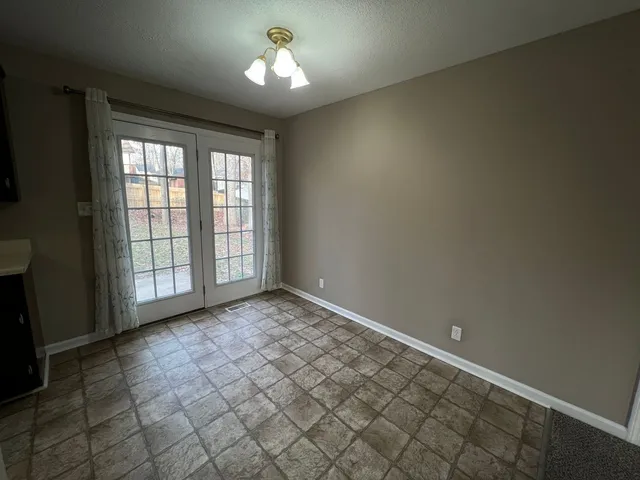 en empty room with windows