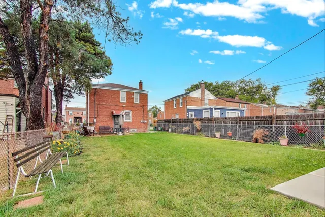 a view of a house with a yard porch and sitting area