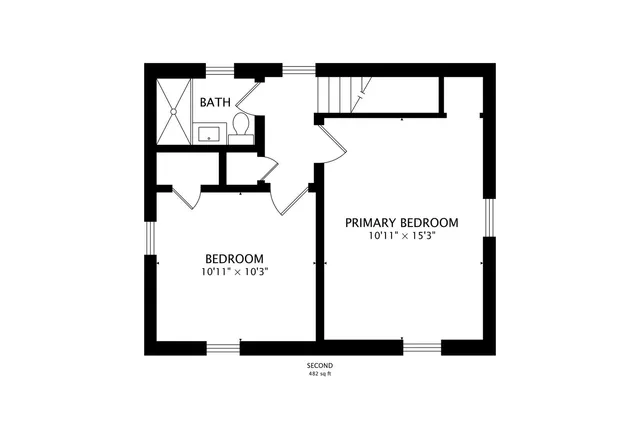 a picture of a bench in front of a wall