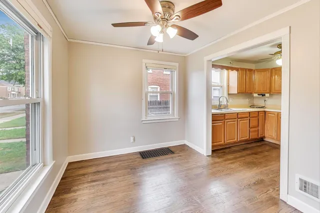 a view of a kitchen with a sink and a window