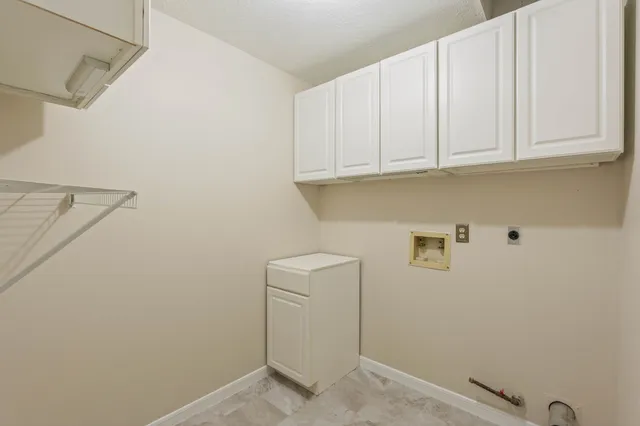 a view of a hallway with entryway door