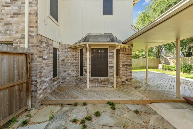 a view of a swimming pool with a porch