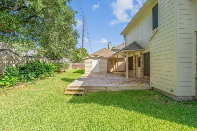 a front view of a house with a yard and porch