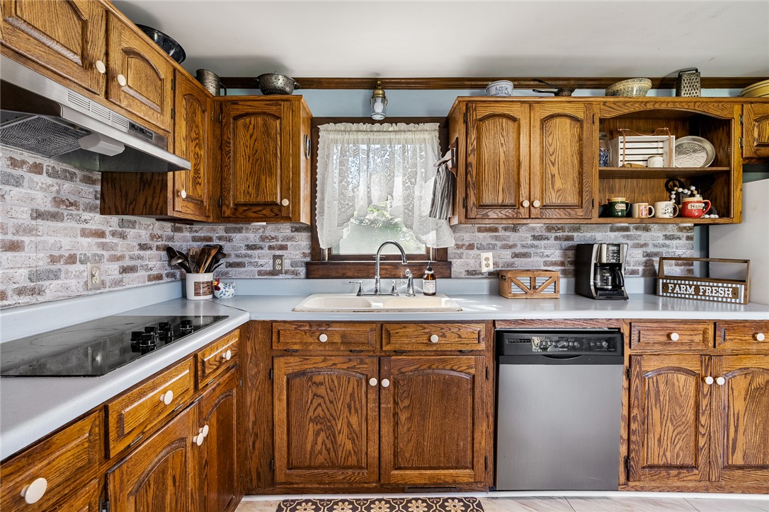 801 Princeton Highway Honea Path, SC 29654 - Photo 12 of 49 This cozy kitchen offers functional charm with ample cabinetry and essential appliances.
