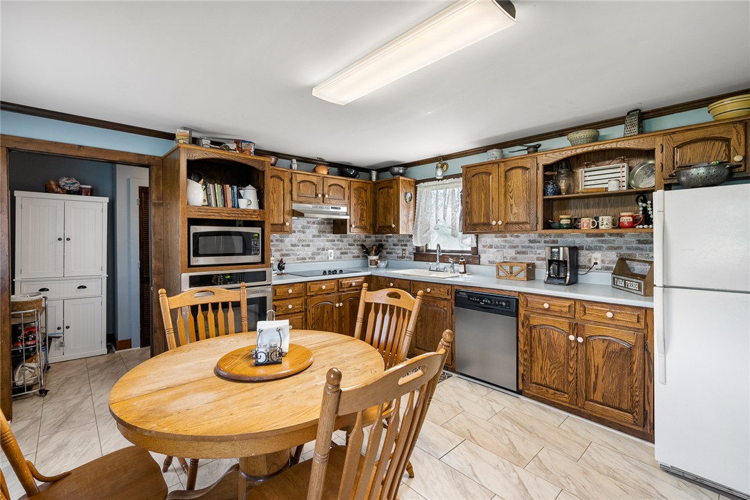 801 Princeton Highway Honea Path, SC 29654 - Photo 14 of 49 This cozy kitchen offers a welcoming atmosphere perfect for everyday meals and entertaining.