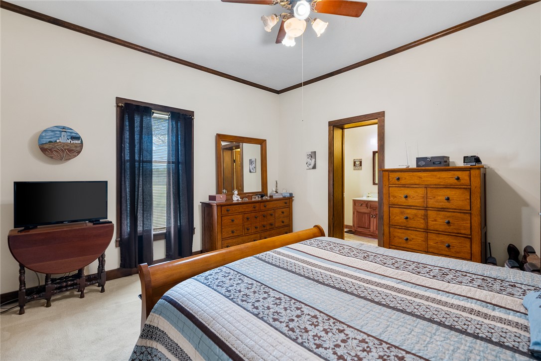 801 Princeton Highway Honea Path, SC 29654 - Photo 17 of 49 This spacious bedroom offers a tranquil retreat with convenient access to a private bathroom.