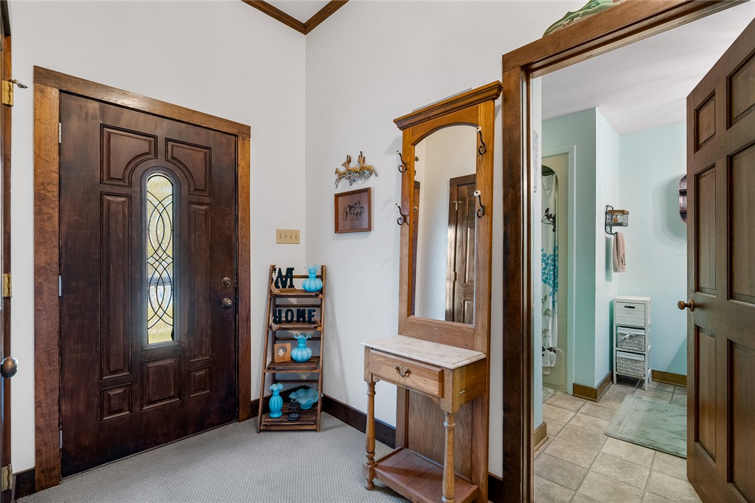 801 Princeton Highway Honea Path, SC 29654 - Photo 21 of 49 The foyer opens into a tiled bathroom, creating a seamless and functional transition.